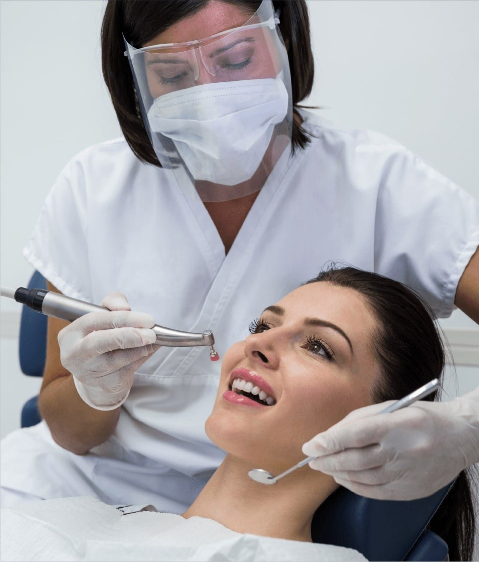 Dentist caring for a patient at Element Dental Clinic